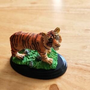 Tiger figurine. Its size is 3" tall and 3  1/2" long. It's a Bengal tiger.